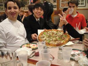 Students eating pizza